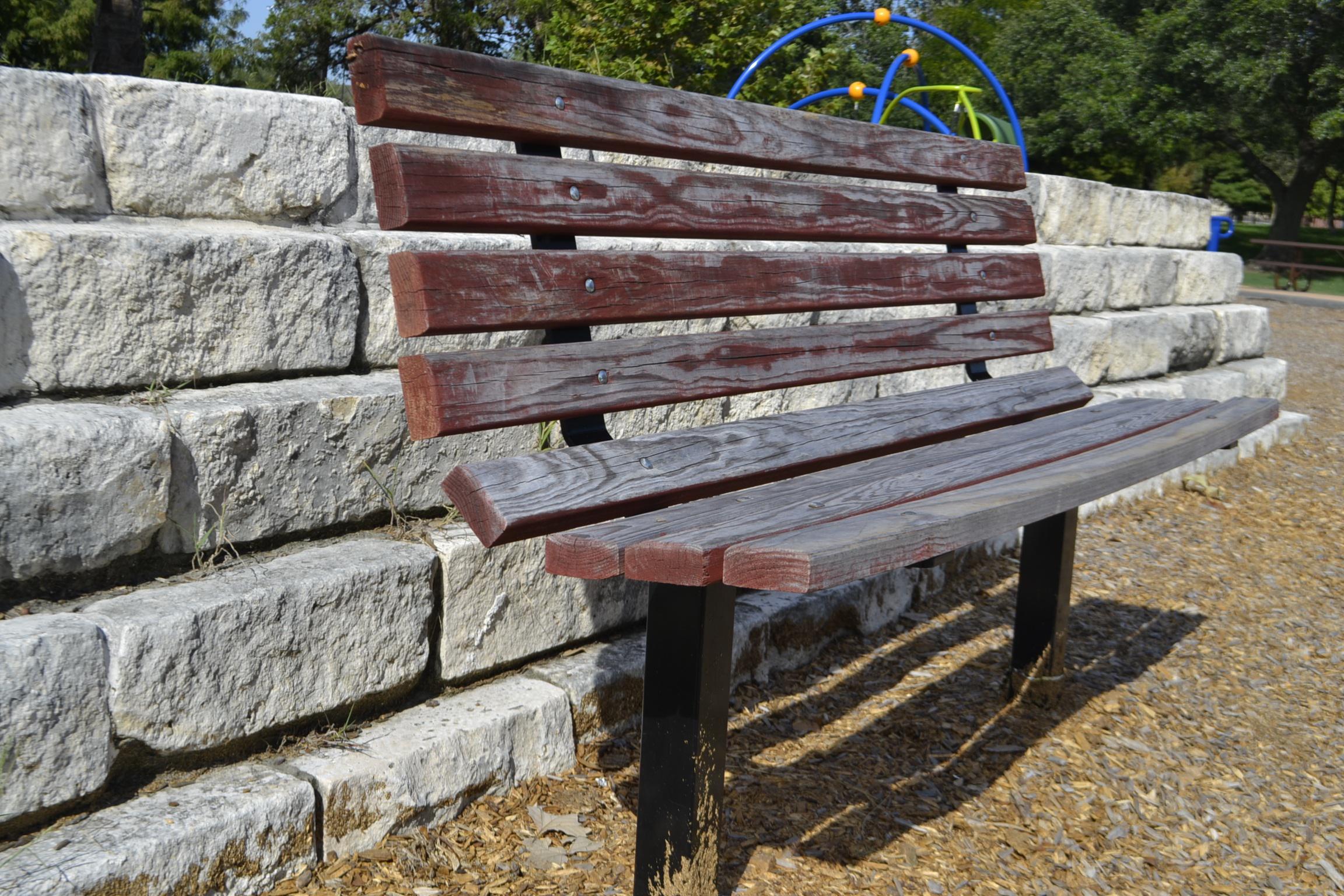 park bench, brick wall, clean